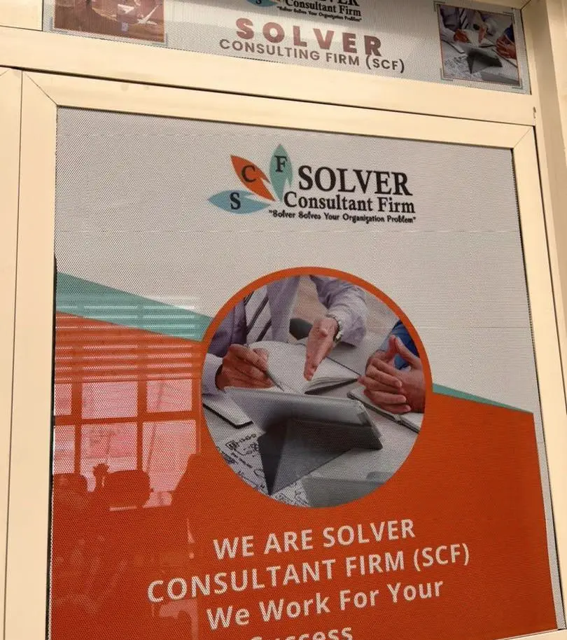 The entrance to SCF’s office in Hargeisa, with the sign “We are Solver Consultant Firm (SCF). We work for your success.”